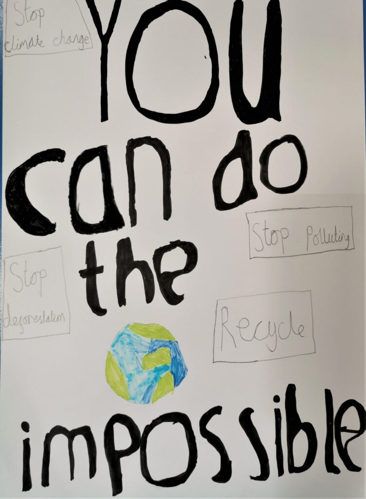 Poster created with pencil and felt pen. Image: the words "You can do the impossible" in bold black pen, and a blue and green picture of the earth take up most of the poster. Four boxes contain the messages "Stop climate change"; "Stop polluting", "Stop deforestation" and "Recycle".